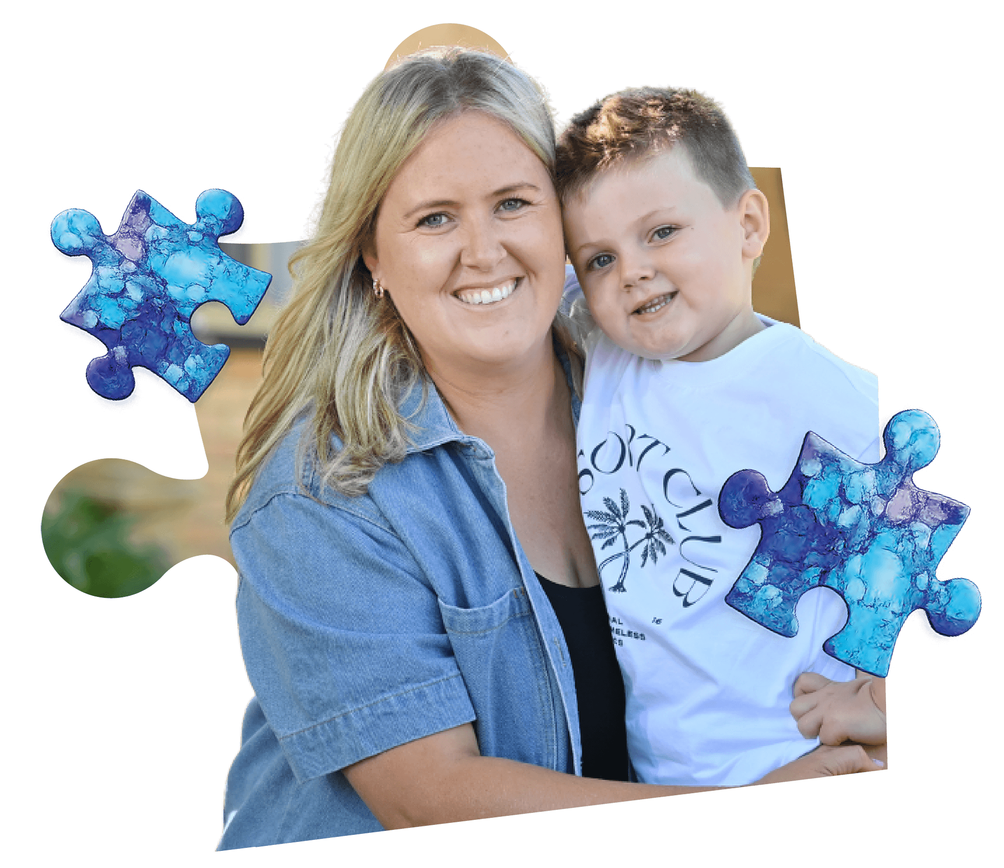 A young boy and his mum smiling at the camera